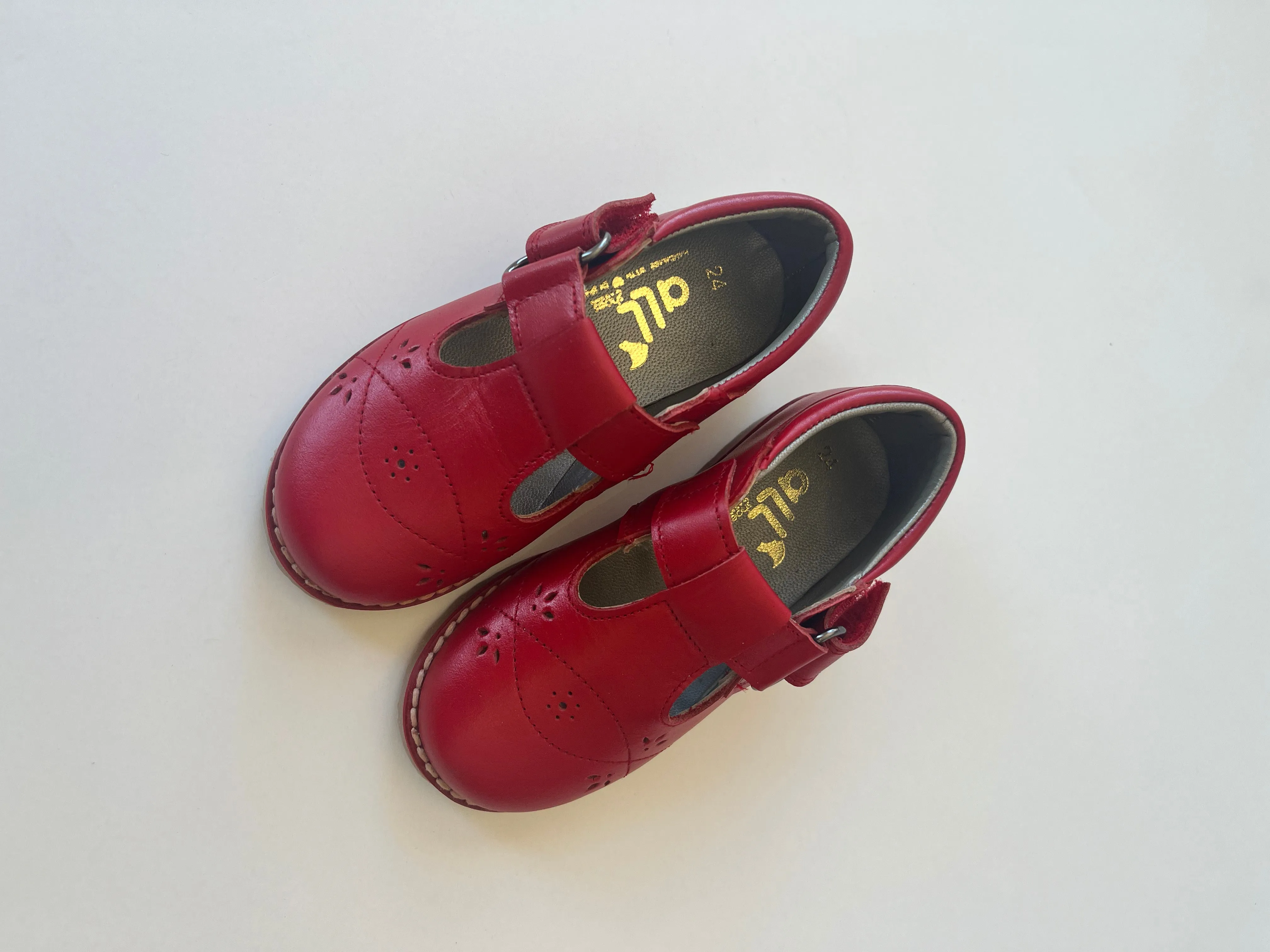 Red t-strap leather shoe